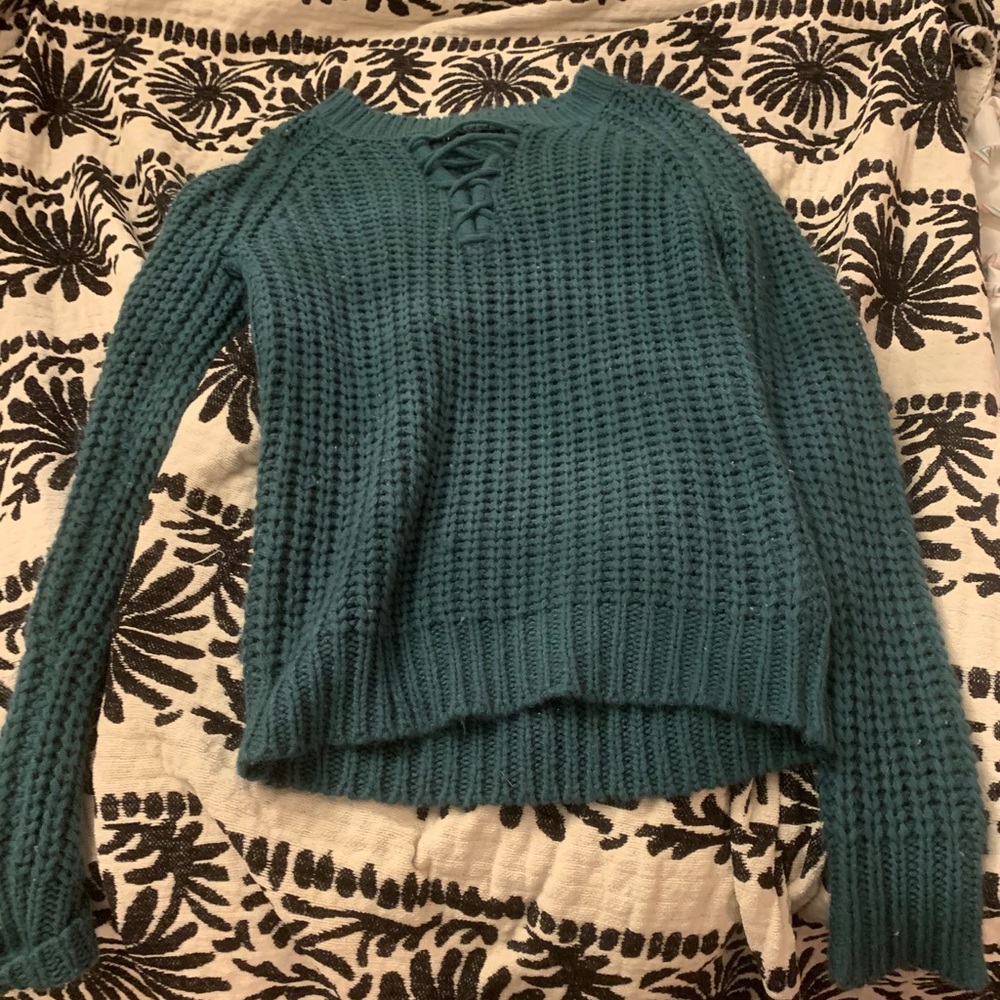 Green sweater, size small, like new.